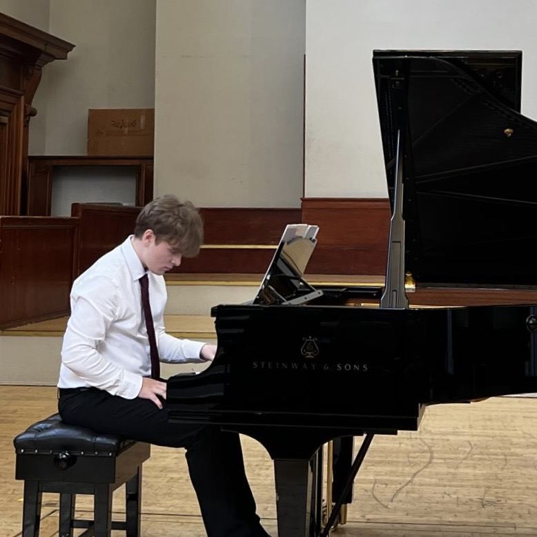 David Dugnas playing a Steinway grand piano